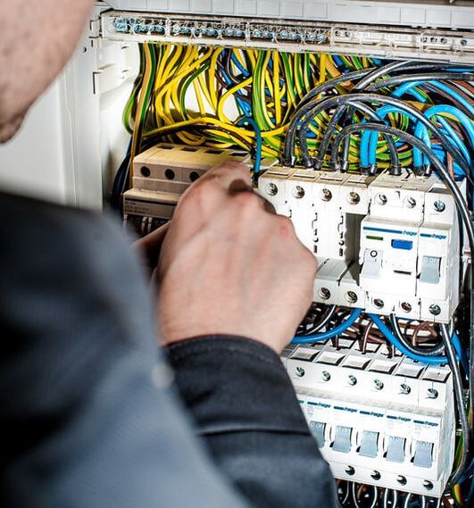 electrician working on panel